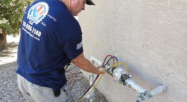 Testing a backflow assembly on site in Tucson